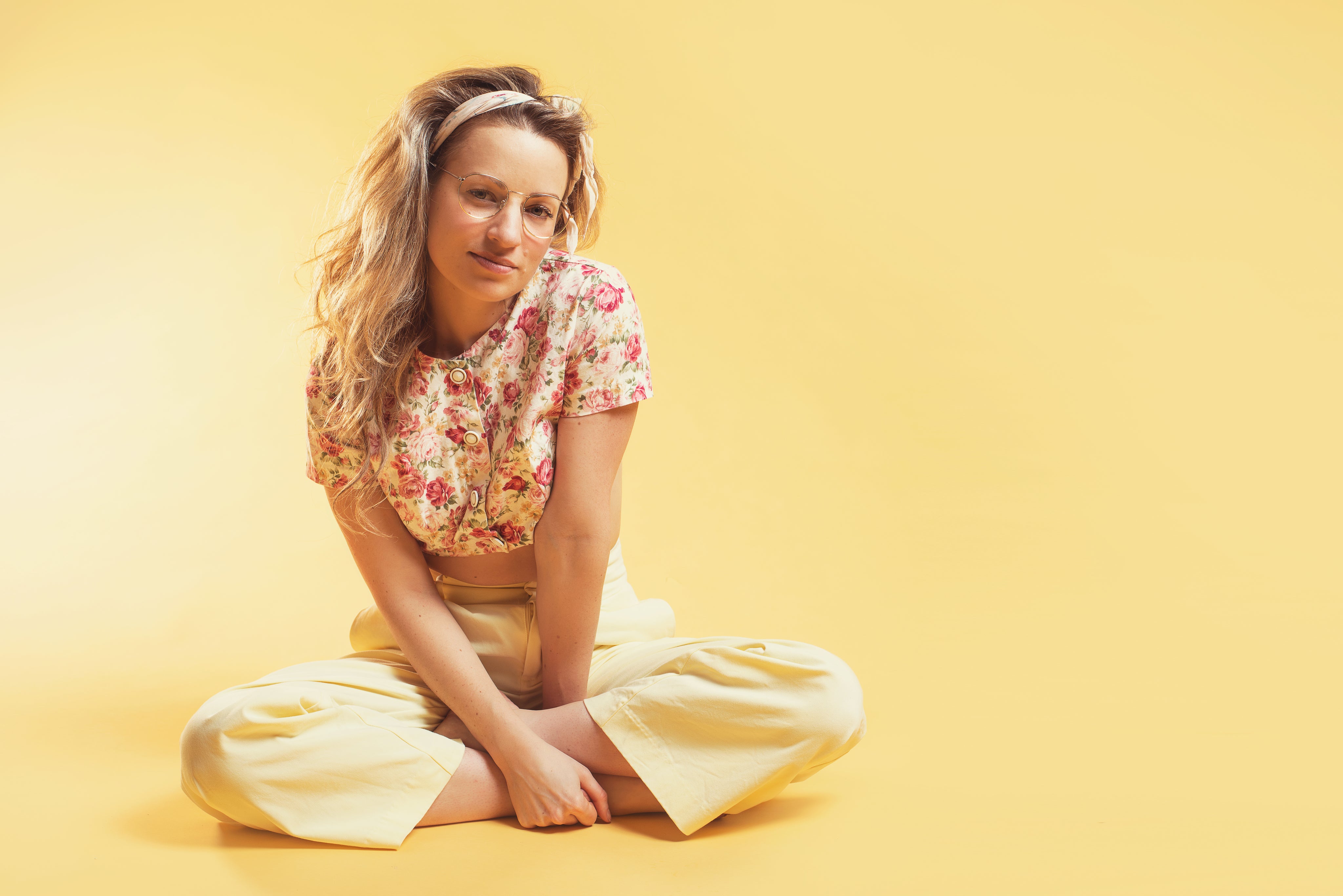 files/person-sits-cross-legged-in-summer-fashion.jpg
